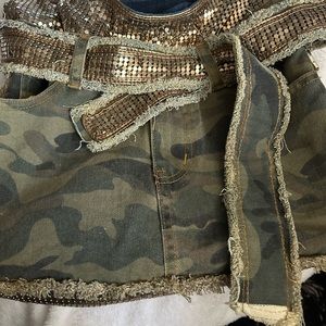 This is a adorable hobo bag made out of gold detail and army jeans.